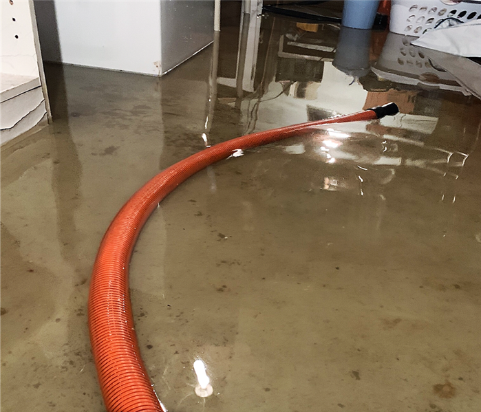 flooded room with hose 