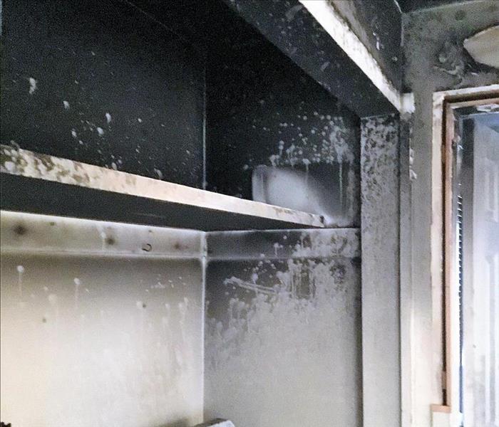 kitchen with soot on the walls