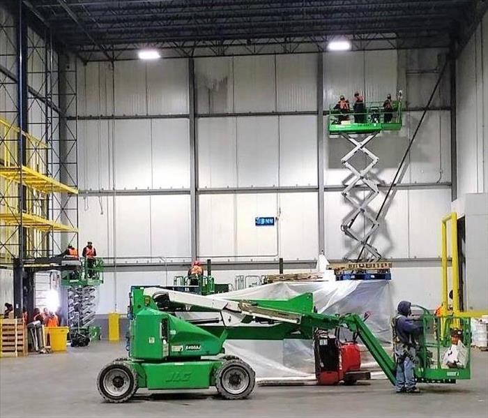 Servpro crew cleaning a warehouse