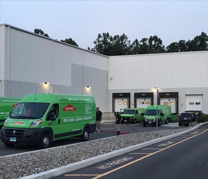 Servpro vans outside of a commercial building